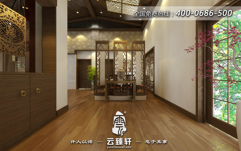 玄關(guān)選擇嚴謹風格的案幾,案幾上擺放的佛像頭像